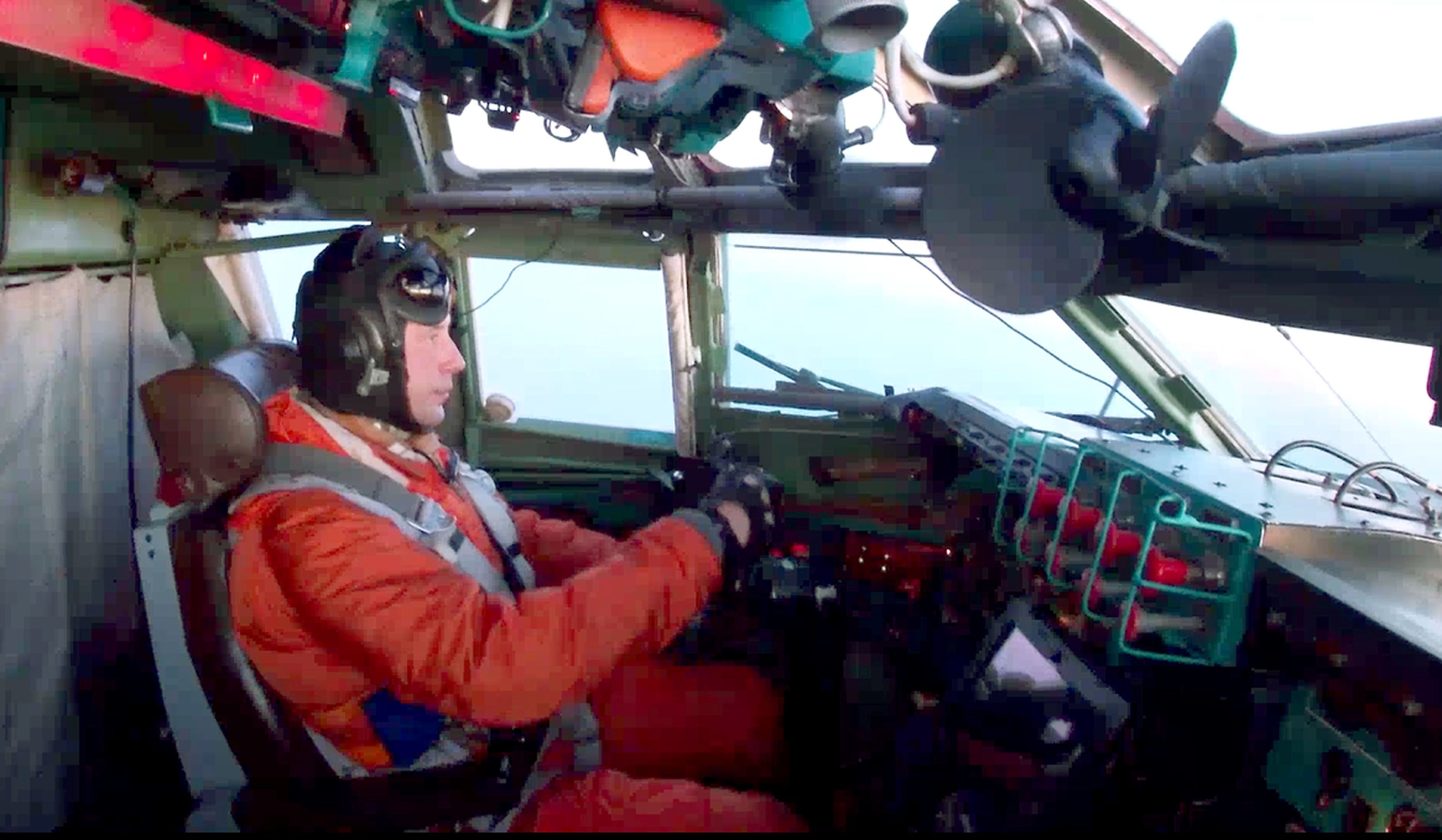 A video grab shows a pilot in the cockpit of a Russian bomber.