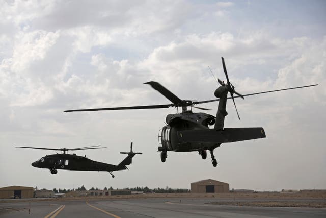 <p>File: A view of UH-60 Black Hawk helicopters </p>