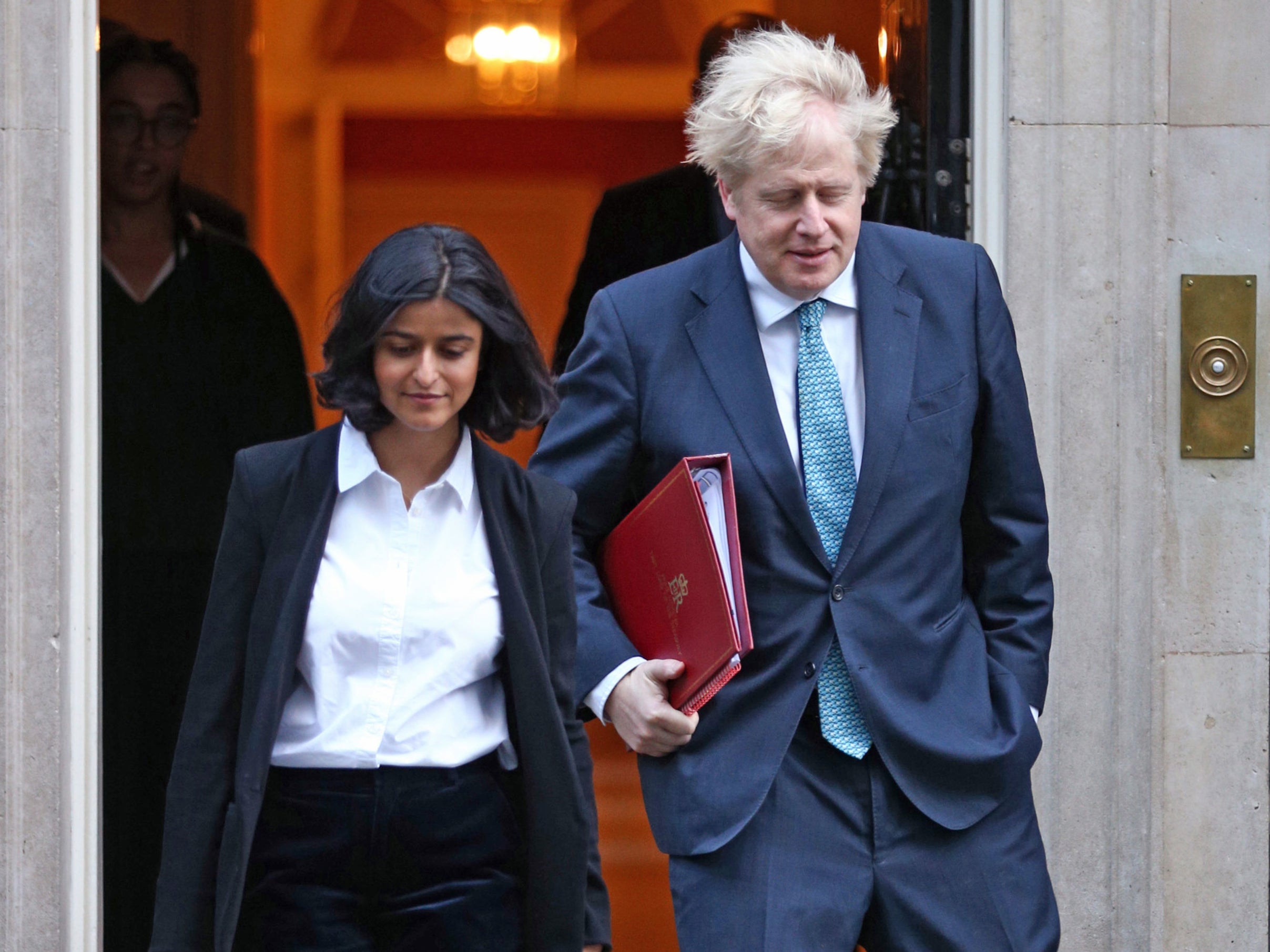 Boris Johnson walking out of Downing Street with Munira Mirza