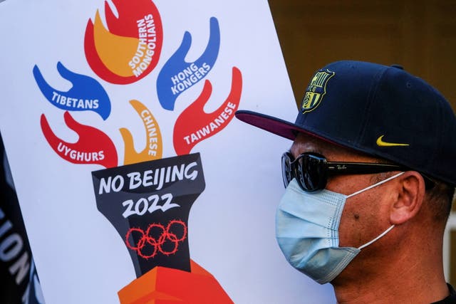 <p>A demonstrator protests against the Beijing Winter Olympics outside the Chinese consulate in Los Angeles, California, US, 3 February 2022</p>