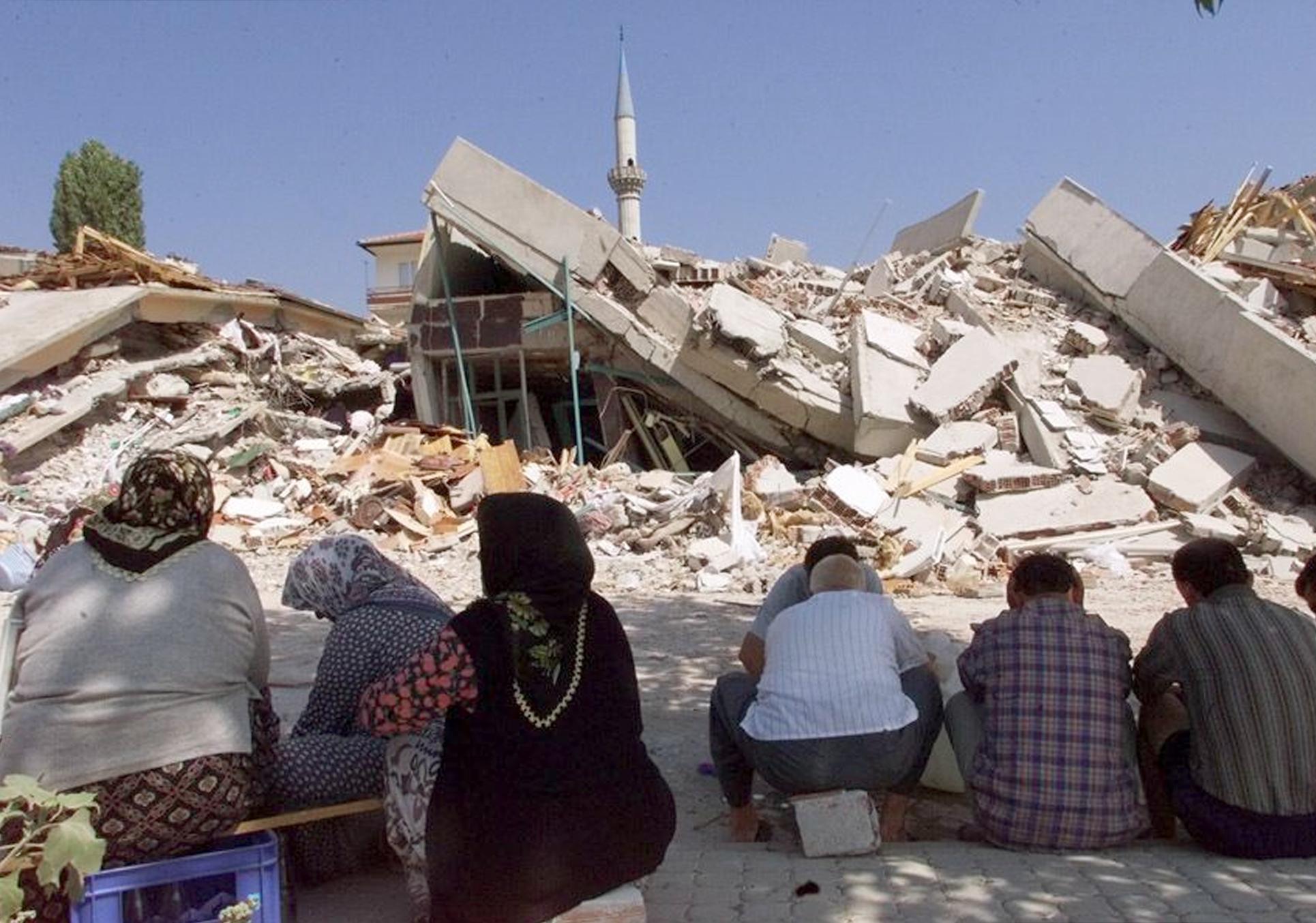 Izmit residents survey the damage the day after the first earthquake, which claimed more than 3,500 lives and injured over 16,500 people