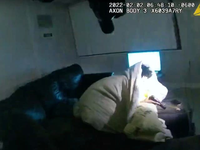 <p>Body camera video shows 22-year-old Amir Locke wrapped in a blanket on a couch holding a gun moments before he was shot by Minneapolis police on Wednesday, Feb 2, 2022</p>