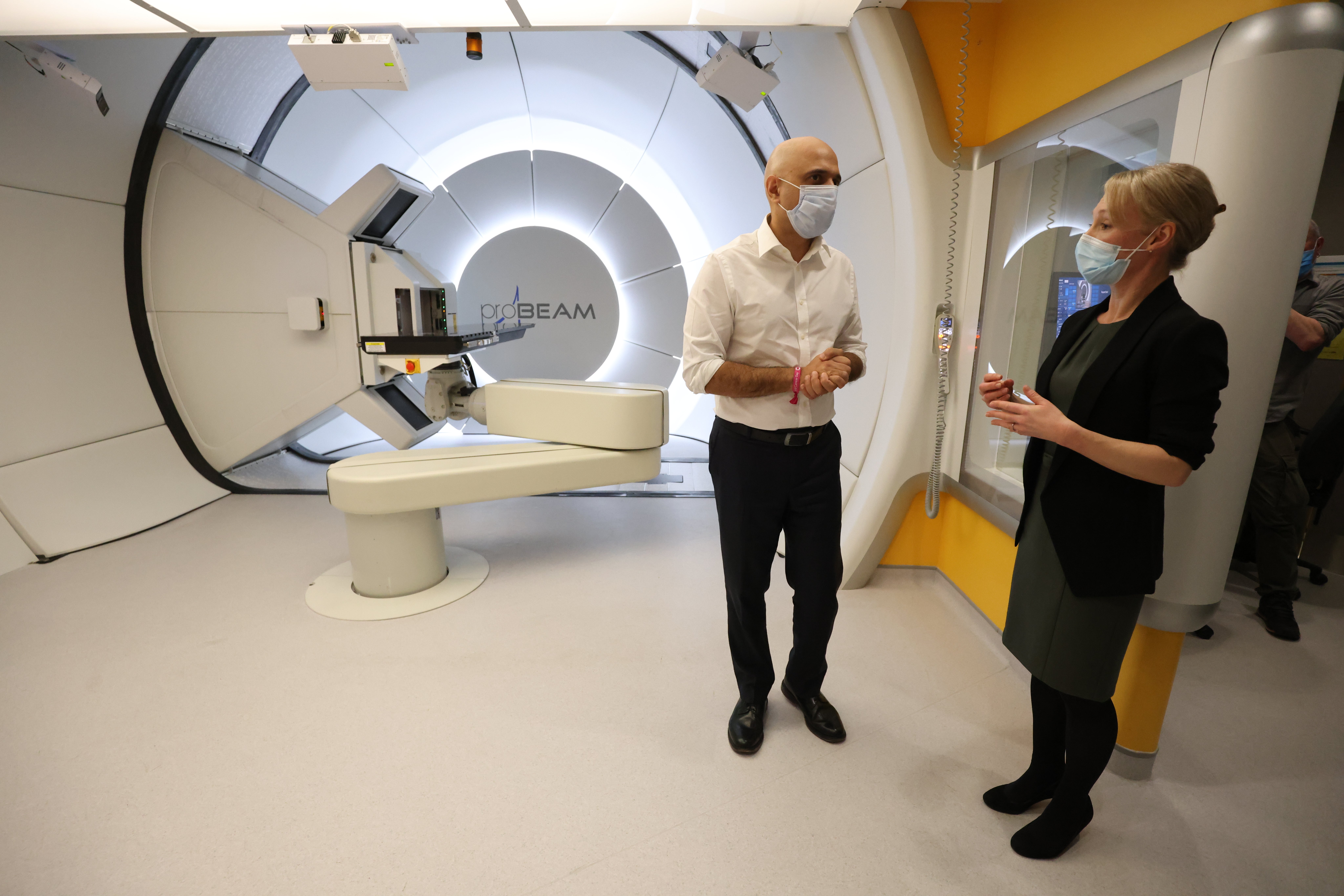 Sajid Javid with therapeutic radiographer Laura Allington as he views the proton beam scanner during a visit to University College Hospital in London to mark World Cancer Day (James Manning/PA)