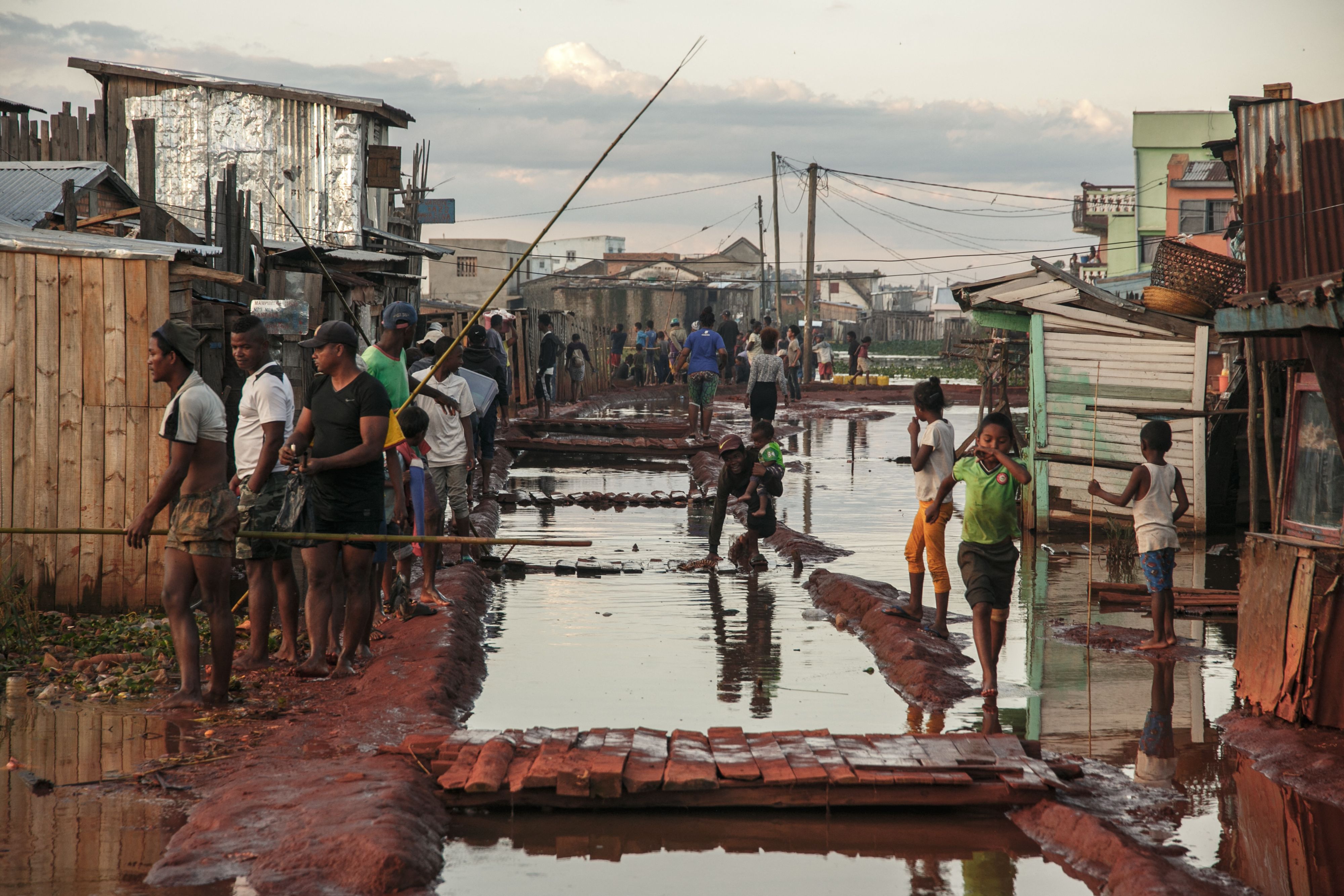 Residents of the Ankasina flooded neighbourhood stand in a flood area in Antananarivo, Madagascar in late January