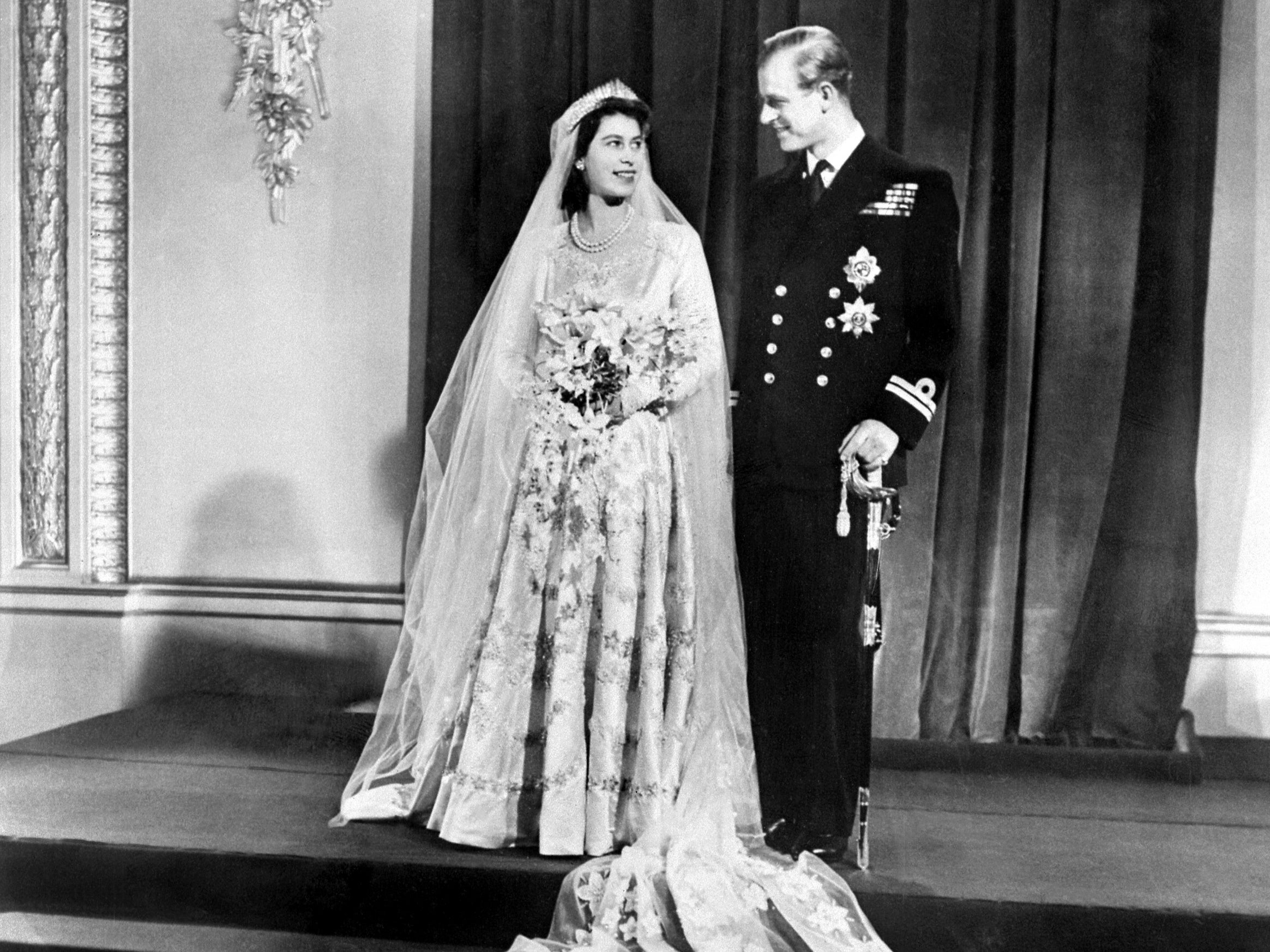 Britain's Princess Elizabeth (future Queen Elizabeth II) (L) and Philip, Duke of Edinburgh (R) pose on their wedding day at Buckingham Palace in London on November 20, 1947