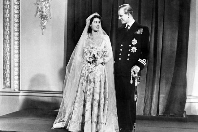 <p>Britain's Princess Elizabeth (future Queen Elizabeth II) (L) and Philip, Duke of Edinburgh (R) pose on their wedding day at Buckingham Palace in London on November 20, 1947</p>