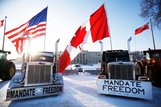 <p>Demonstrators rally against Covid-19 vaccine mandates outside the Manitoba Legislature in Winnipeg, Manitoba</p>