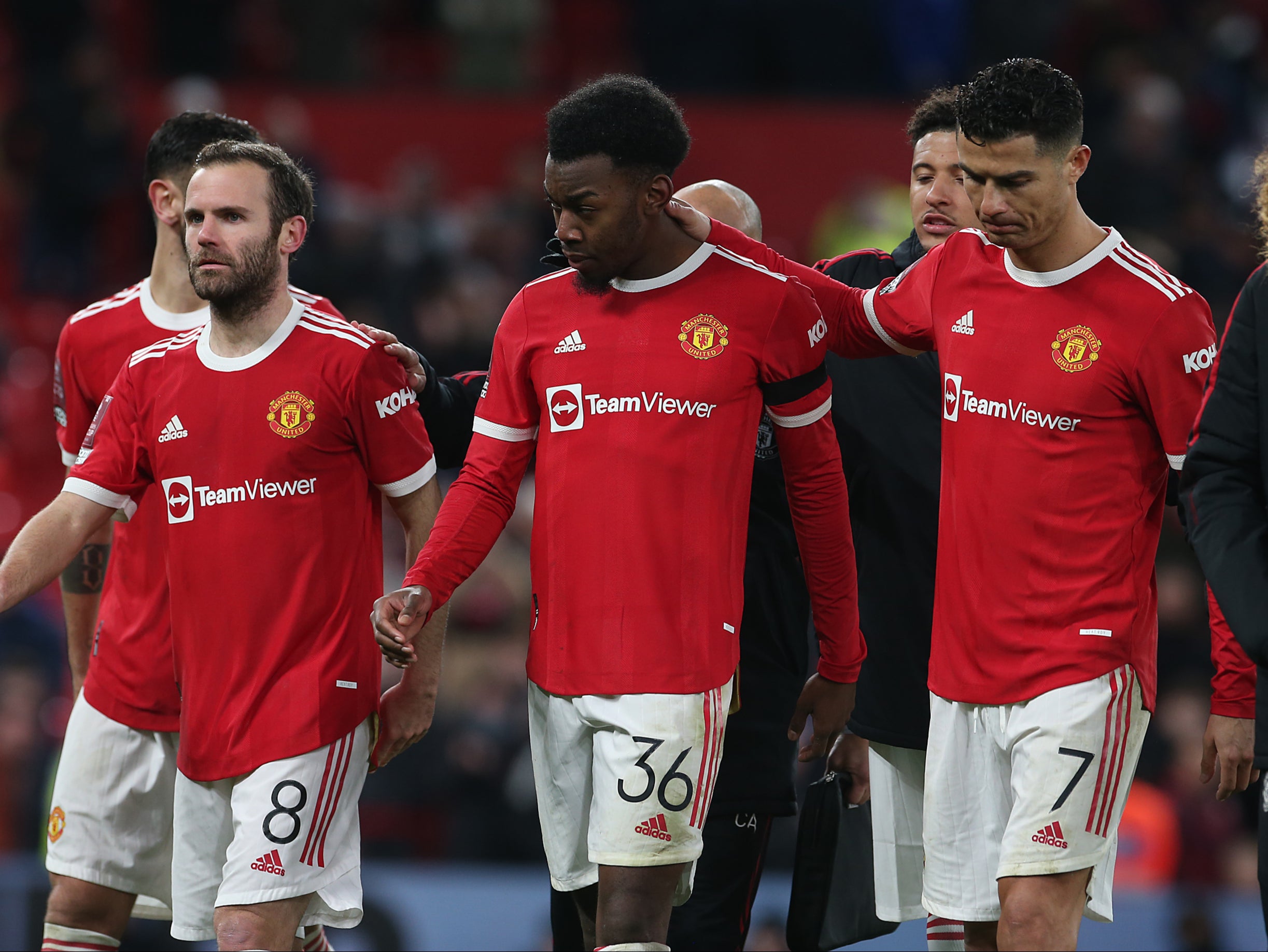 Manchester United teenager Anthony Elanga is consoled after missing his penalty