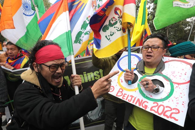 <p>Tibetans living in exile in India take part in a protest march in Delhi against the 2022 Beijing Winter Olympics</p>