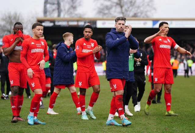 Kidderminster Harriers players applaud their fans after FA Cup defeat to West Ham (David Davies/PA)