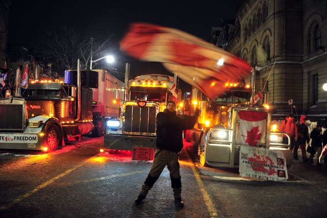 <p>Demonstrators gather in downtown Ottawa in support of the Freedom Truck Convoy on Friday</p>