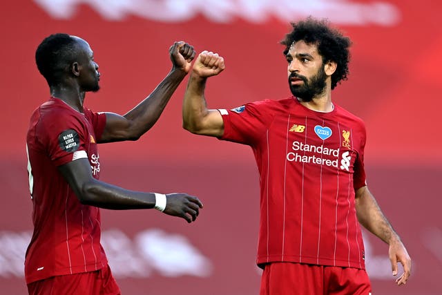 Liverpool teammates Sadio Mane (left) and Mohamed Salah will be on opposite sides in the Africa Cup of Nations final (Paul Ellis/NMC Pool)