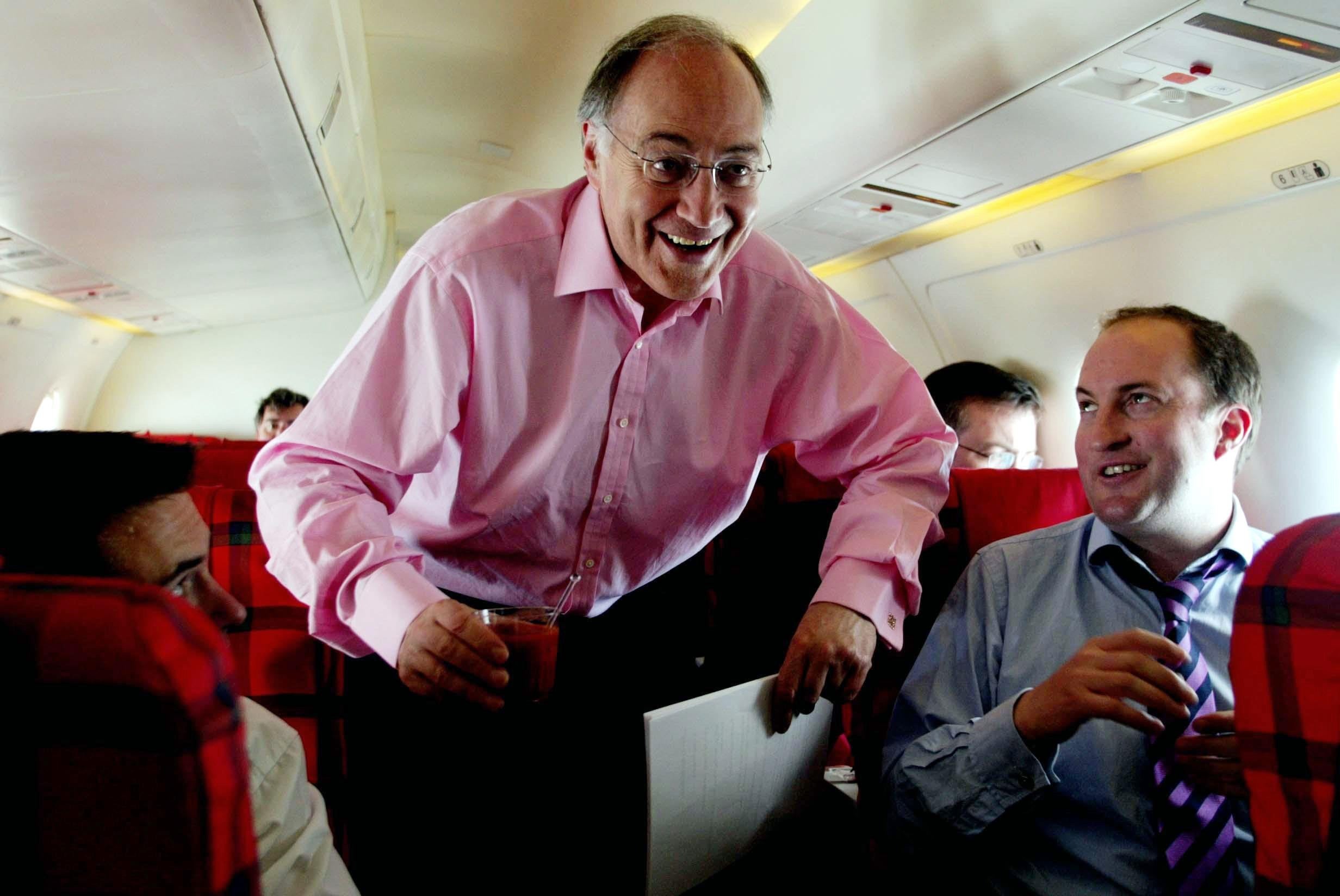 Then leader of the Conservative Party Michael Howard speaks to Guto Harri when he was political correspondent for the BBC (Andrew Parsons/PA)
