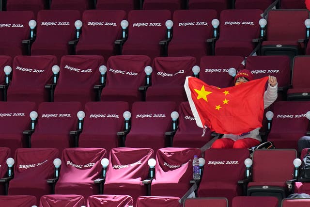 <p>File: A spectator waves a Chinese flag during the Winter Olympics </p>