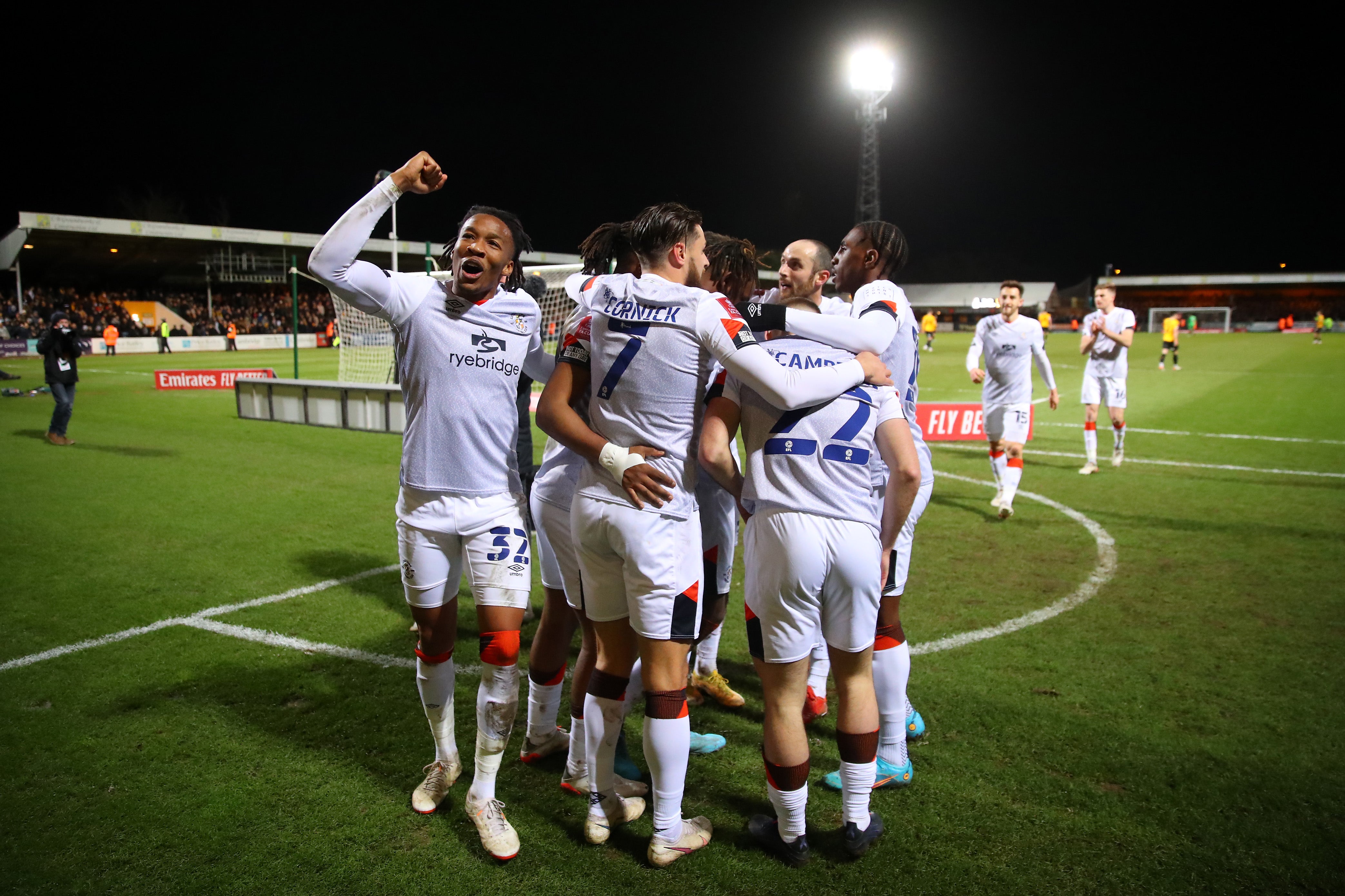 Luton Town celebrate after defeating Cambridge United