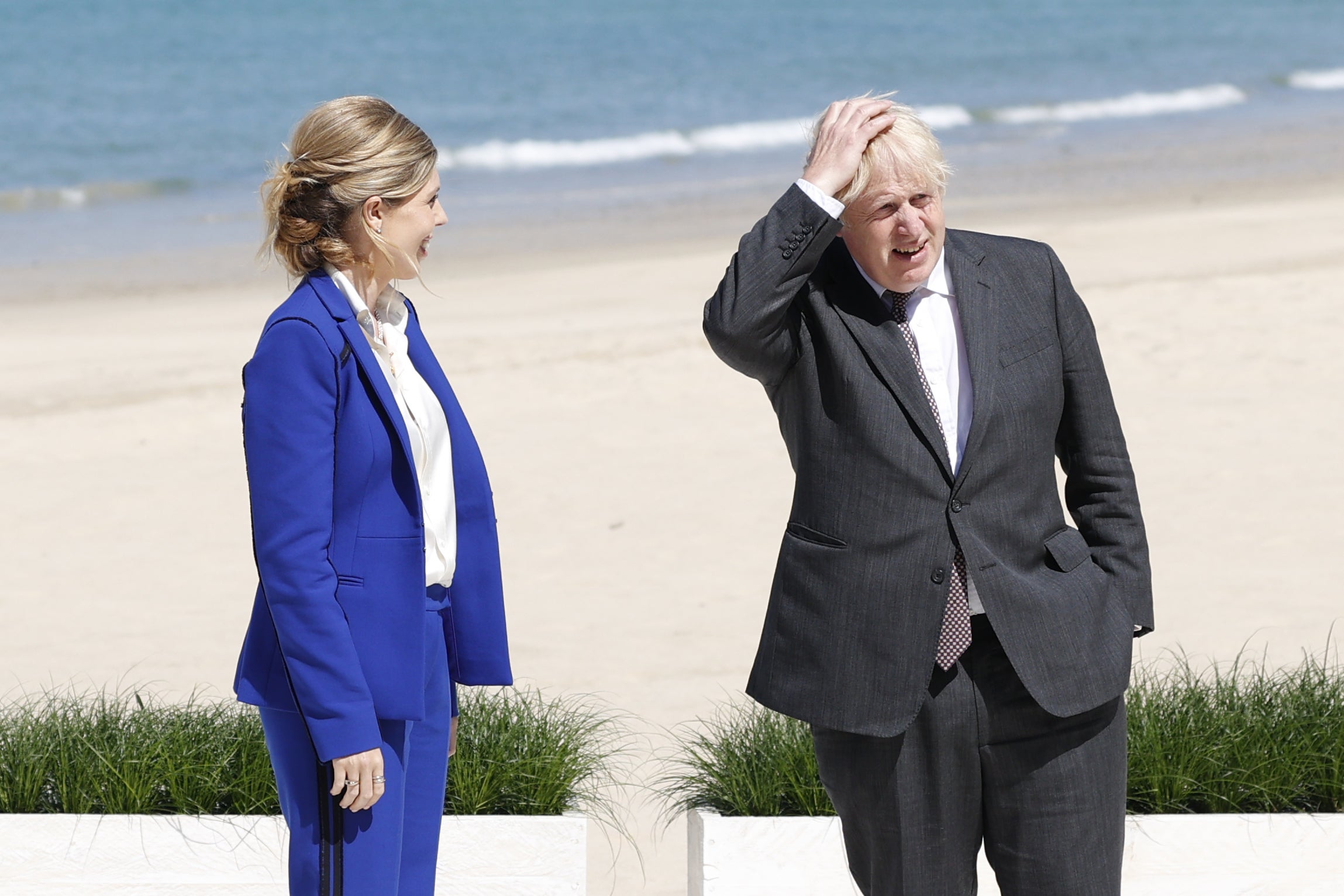 Prime Minister Boris Johnson and his wife Carrie wait for arrivals during an official welcome of guests at the G7 summit in Cornwall (Adrian Dennis/PA)