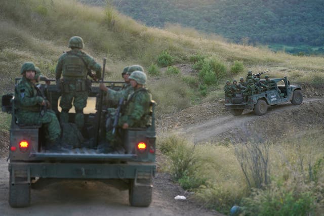 <p>Soldiers patrol near the hamlet Plaza Vieja in the Michoacan state of Mexico, Oct. 28, 2021</p>