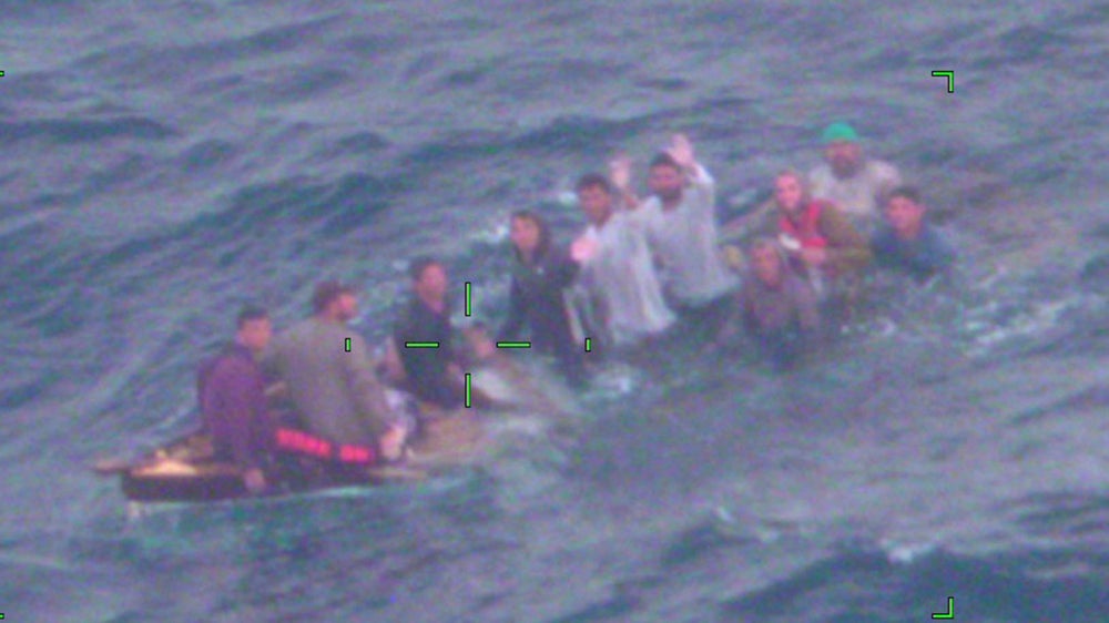 Cuban migrants pictured on a sinking vessel off the coast of Florida on Thursday