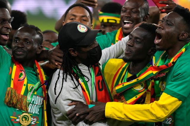 Senegal coach Aliou Cisse, centre, celebrates with his players after their Africa Cup of Nations final victory (Themba Hadebe/AP/PA)