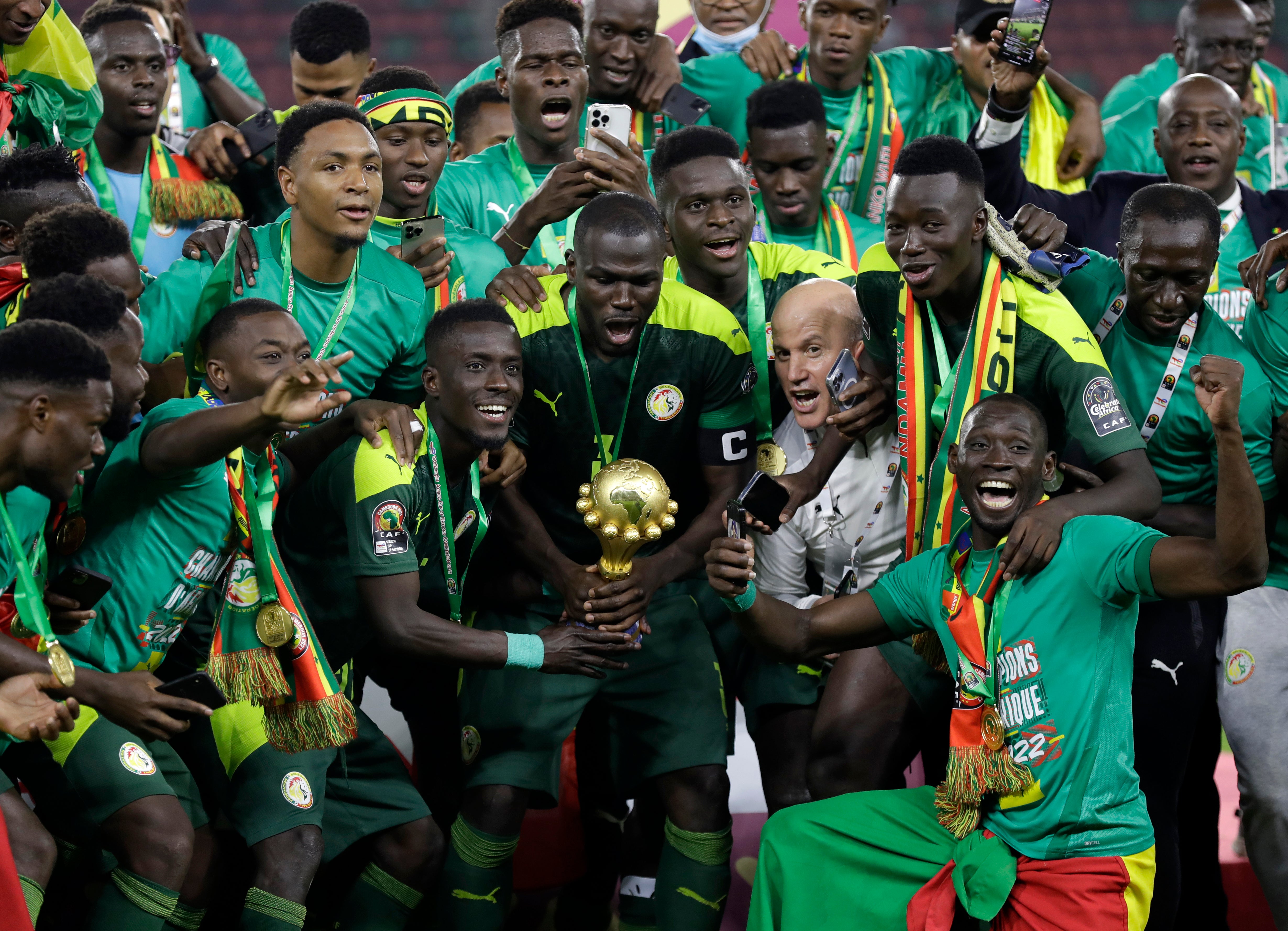Senegal celebrate with trophy after winning the African Cup of Nations final on penalties (Sunday Alamba/AP/PA)