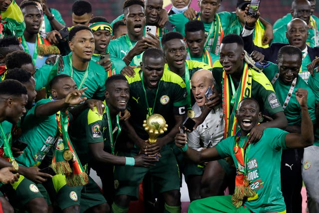 Senegal celebrate with trophy after winning the African Cup of Nations final on penalties (Sunday Alamba/AP/PA)