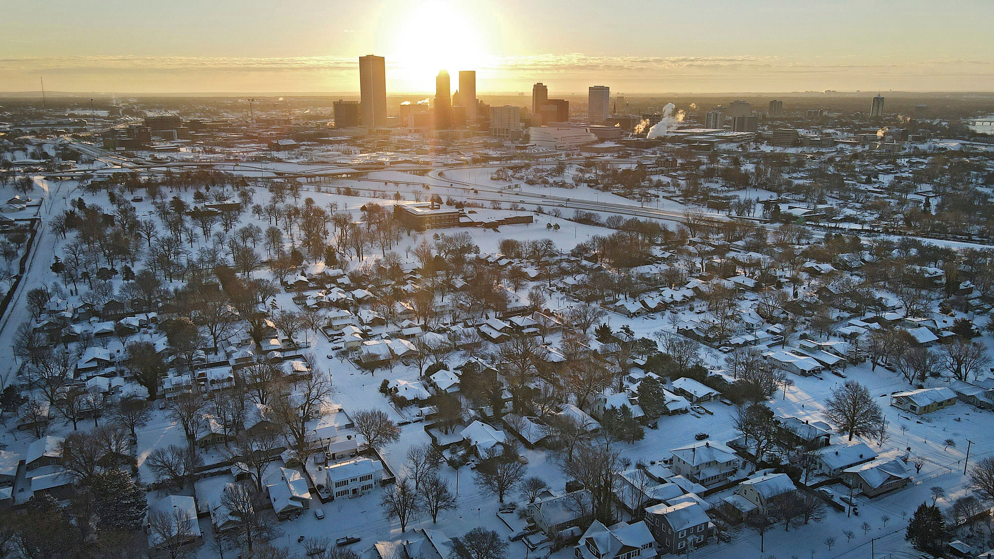 The sun rises over Tulsa, Oklahoma, after a major winter storm cut electric power to about 350,000 homes and businesses from Texas to the Ohio Valley.