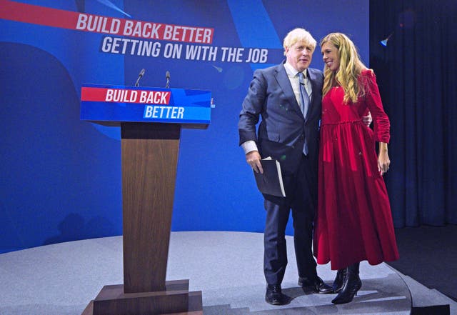 <p>Prime minister Boris Johnson is joined by his wife Carrie on stage after delivering his keynote speech at the 2021 Conservative Party conference in Manchester</p>