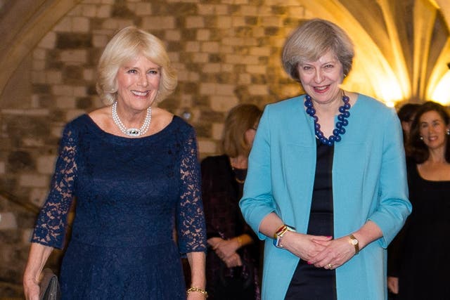 <p>The Duchess of Cornwall and Theresa May </p>
