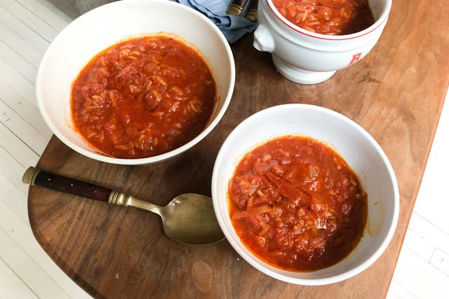 <p>The flavour of this tomato soup with rice is extra rich thanks to caramelised tomato paste</p>