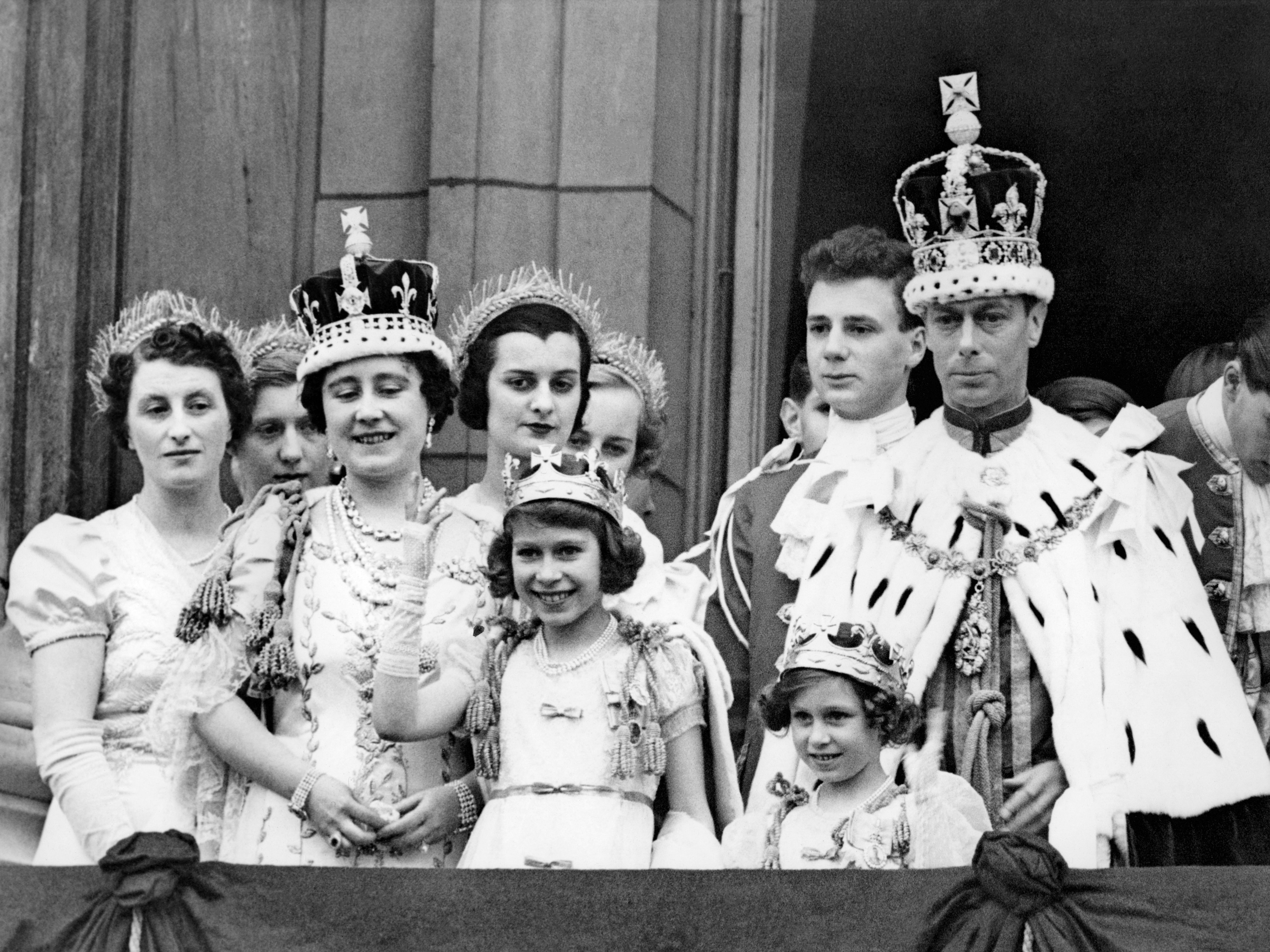 Queen Elizabeth (2nd-L, future Queen Mother), her daughter Princess Elizabeth (4th-L, future Queen Elizabeth II), Queen Mary (C) , Princess Margaret (5th-L) and the King George VI (R), pose at the balcony of the Buckingham Palace on May 12, 1937