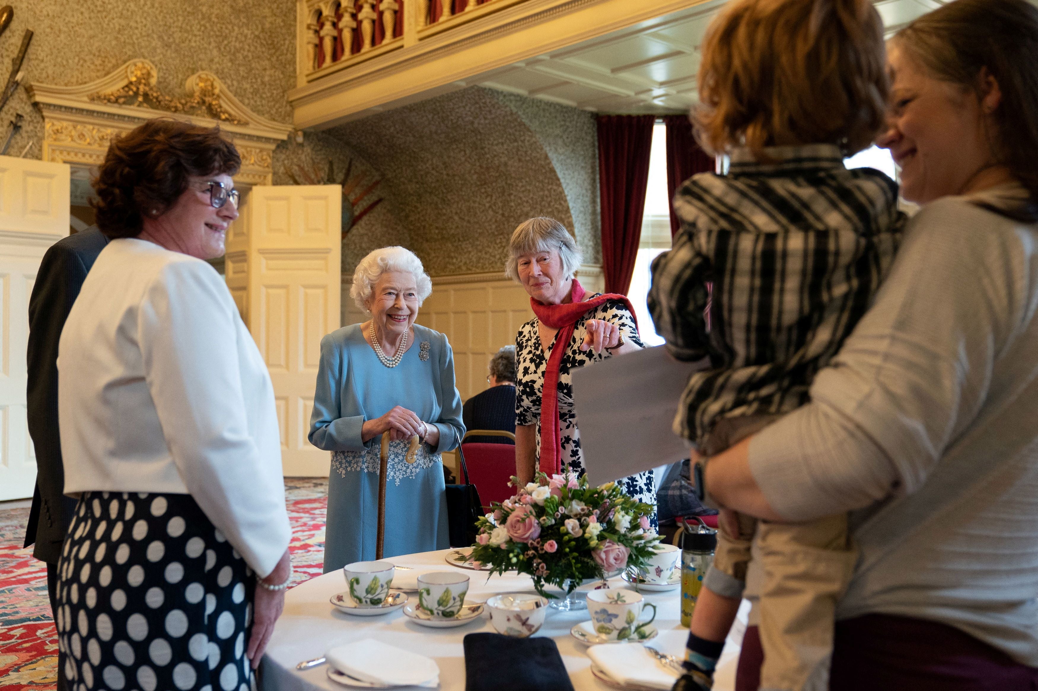 Queen Elizabeth and representatives from local community group Little Discoverers attend a reception in the Ballroom of Sandringham House to celebrate the start of the Platinum Jubilee