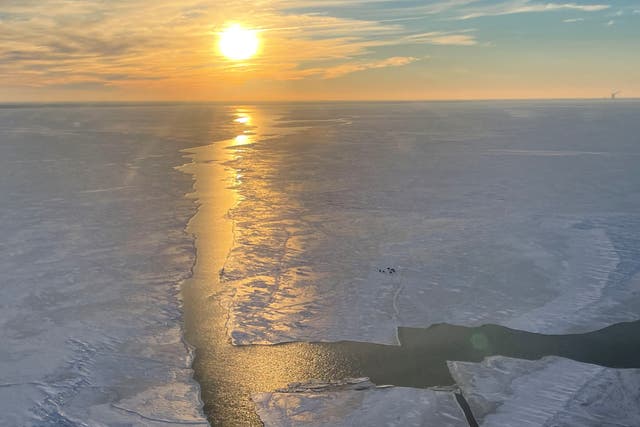 <p>An aerial view of people trapped near Catawba island after they got stranded by an ice break in Lake Erie, in Port Clinton, Ohio, United States February 6, 2022</p>