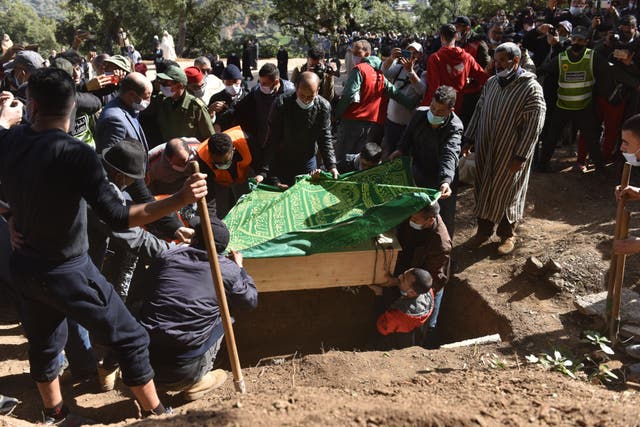 <p>People carry the coffin of Rayan Awram during the funeral of the 5-year-old child, who died after being trapped deep inside a well for days near Chefchaouen, Morocco, 7 February 2022</p>