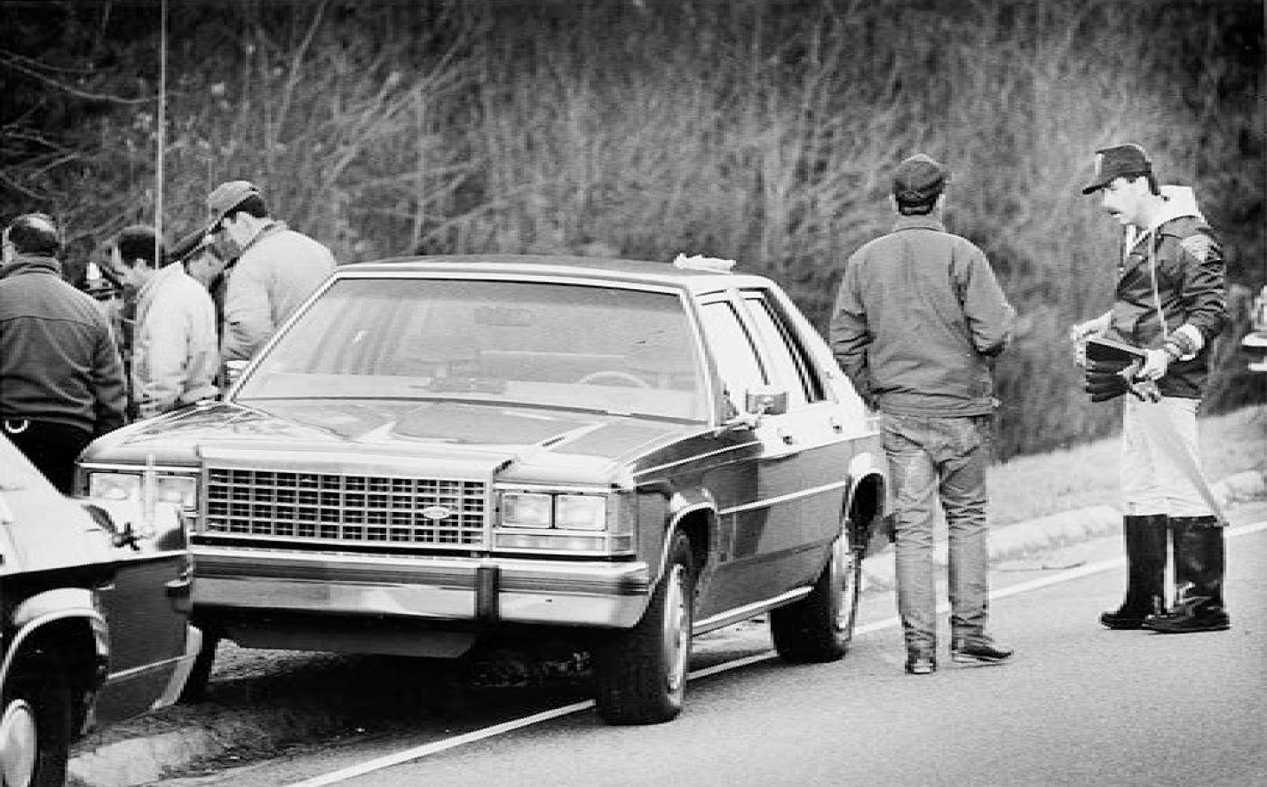 State Trooper Kevin Butler, far right, on the Reed Road westbound entrance ramp to Interstate 195 in Dartmouth where Andy Rebmann’s dog found the remains of Dawn Mendes in November 1988 (Standard-Times photo by Jack Iddon)