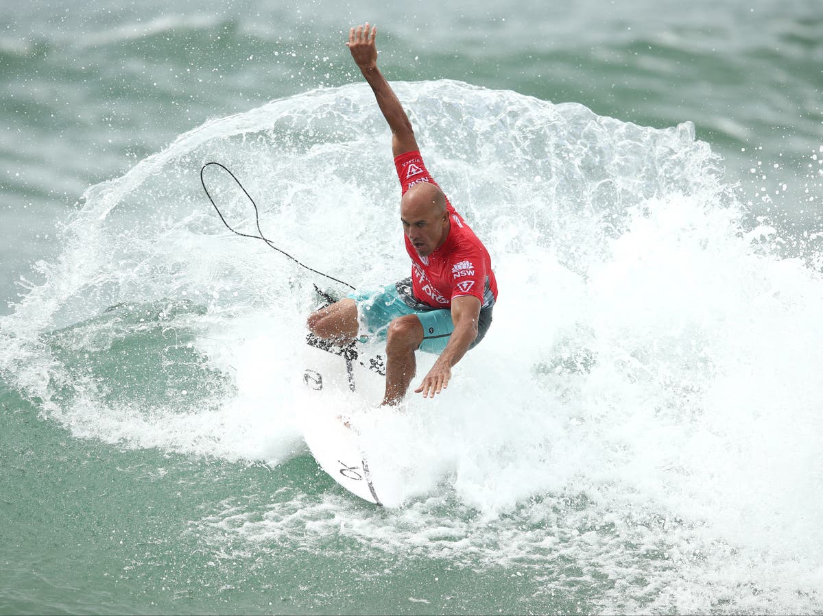 Fans applaud surfer Kelly Slater after he wins tournament days before 50th birthday