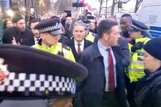 Keir Starmer bundled into police car after being swarmed by protesters shouting abuse and Savile slurs