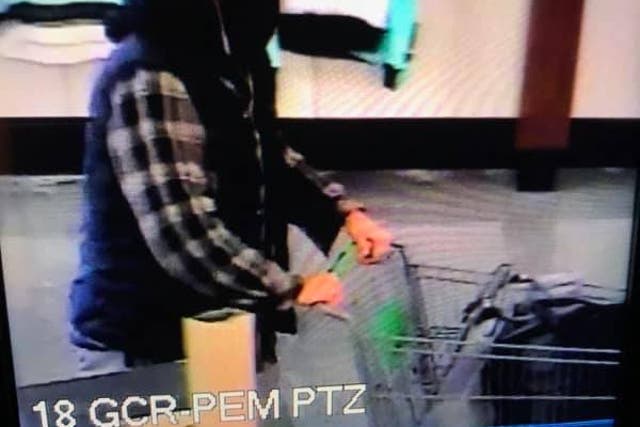 <p>A security camera image of a man with a bandanna over his face, who police in Richland, Washington believe may have committed a shooting that reportedly left multiple people injured at a Fred Meyer grocery store on 7 February, 2022.</p>