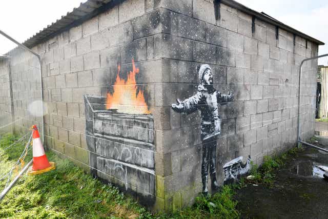 Artwork by Banksy, which appeared on a garage wall in Taibach, Port Talbot (PA)