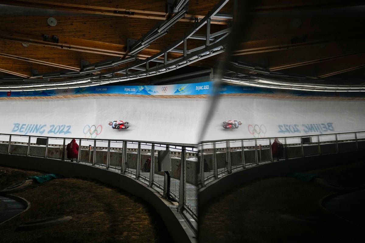 AP PHOTOS: A Day 2 filled with crashes at Beijing Olympics