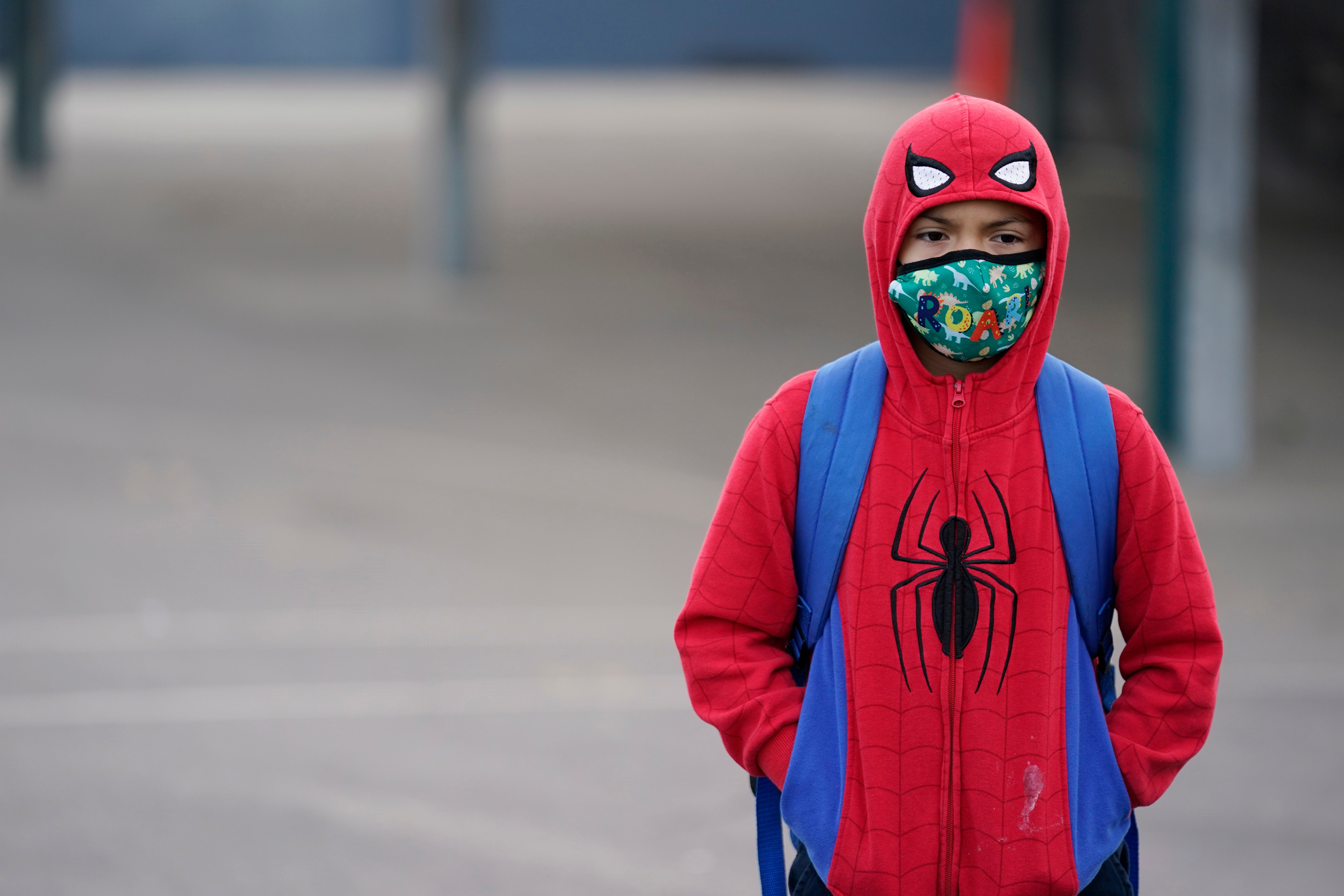 File: A student wears a mask while waiting for class to start amid the Covid pandemic at Washington Elementary School on Wednesday