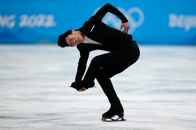 Nathan Chen nailed a world record score in his short program in Beijing (David J. Phillip/AP)