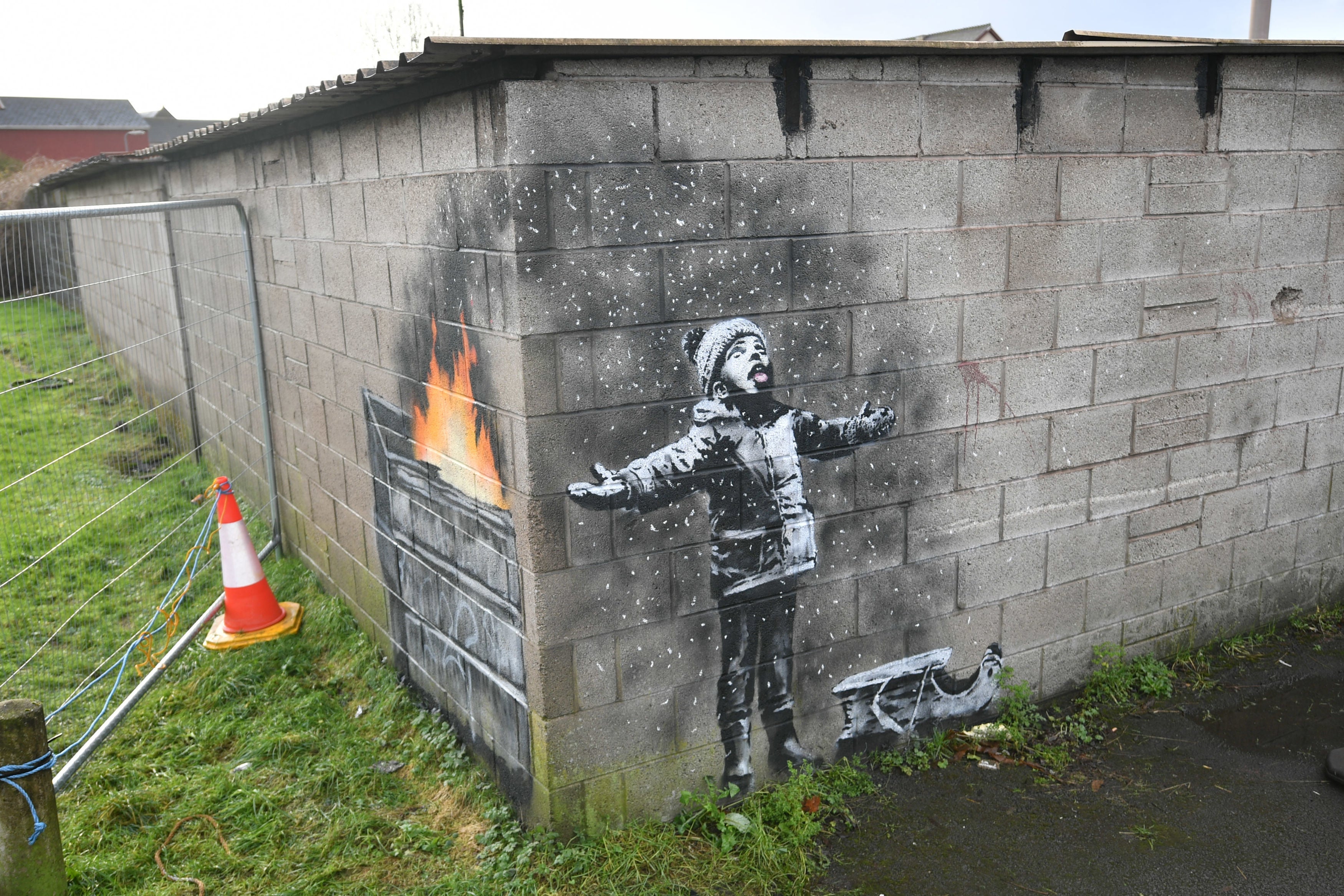 Banksy’s Season’s Greetings appeared on the outside of a steelworker’s private garage in Taibach, Port Talbot on December 19 2018 (Ben Birchall/PA)