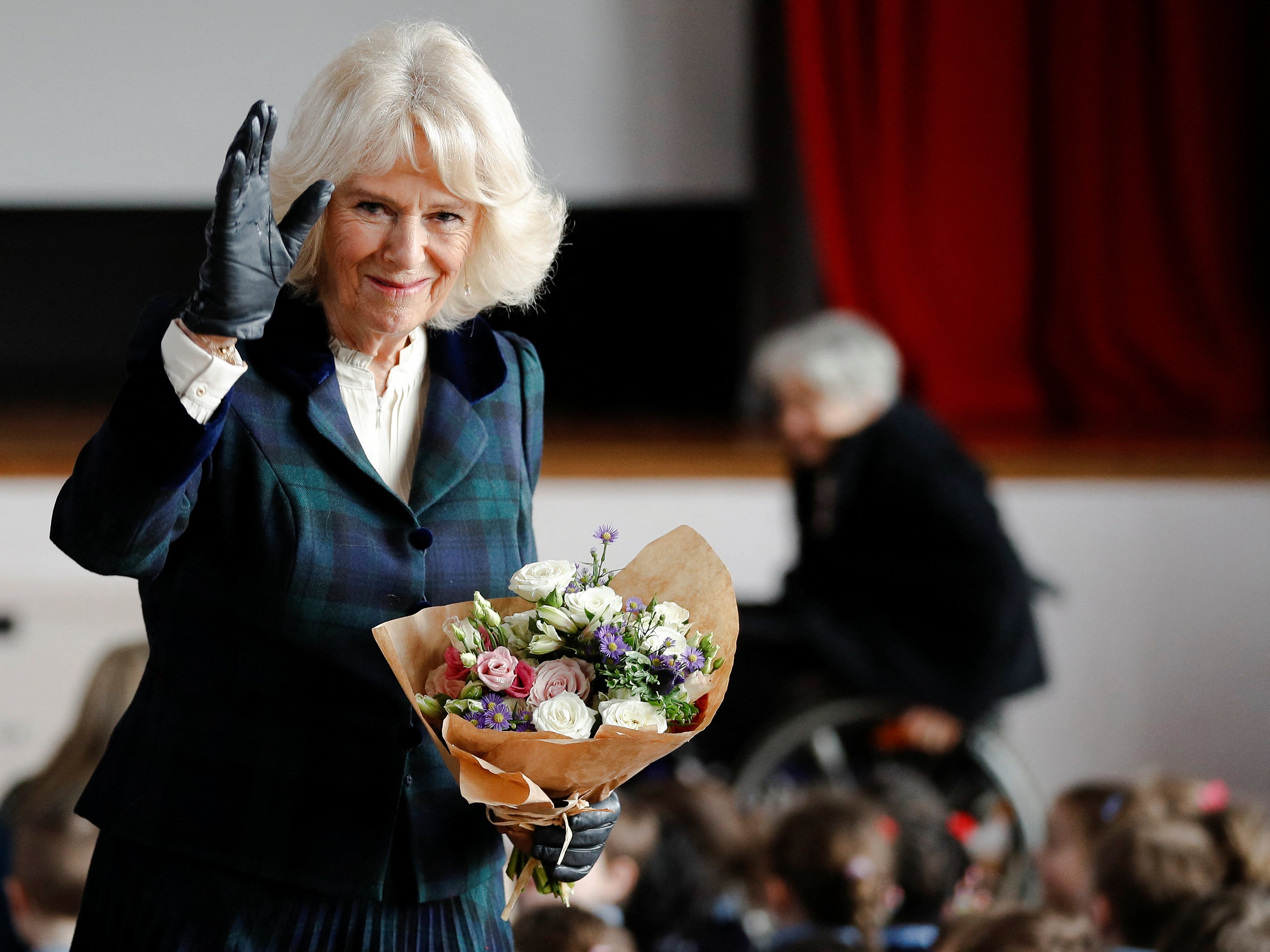 Camilla, Duchess of Cornwall, gestures during her visit to the Roundhill Primary School in Bath