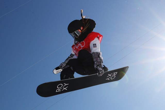 <p>Chloe Kim of Team United States performs a trick during the snowboard halfpipe training session</p>
