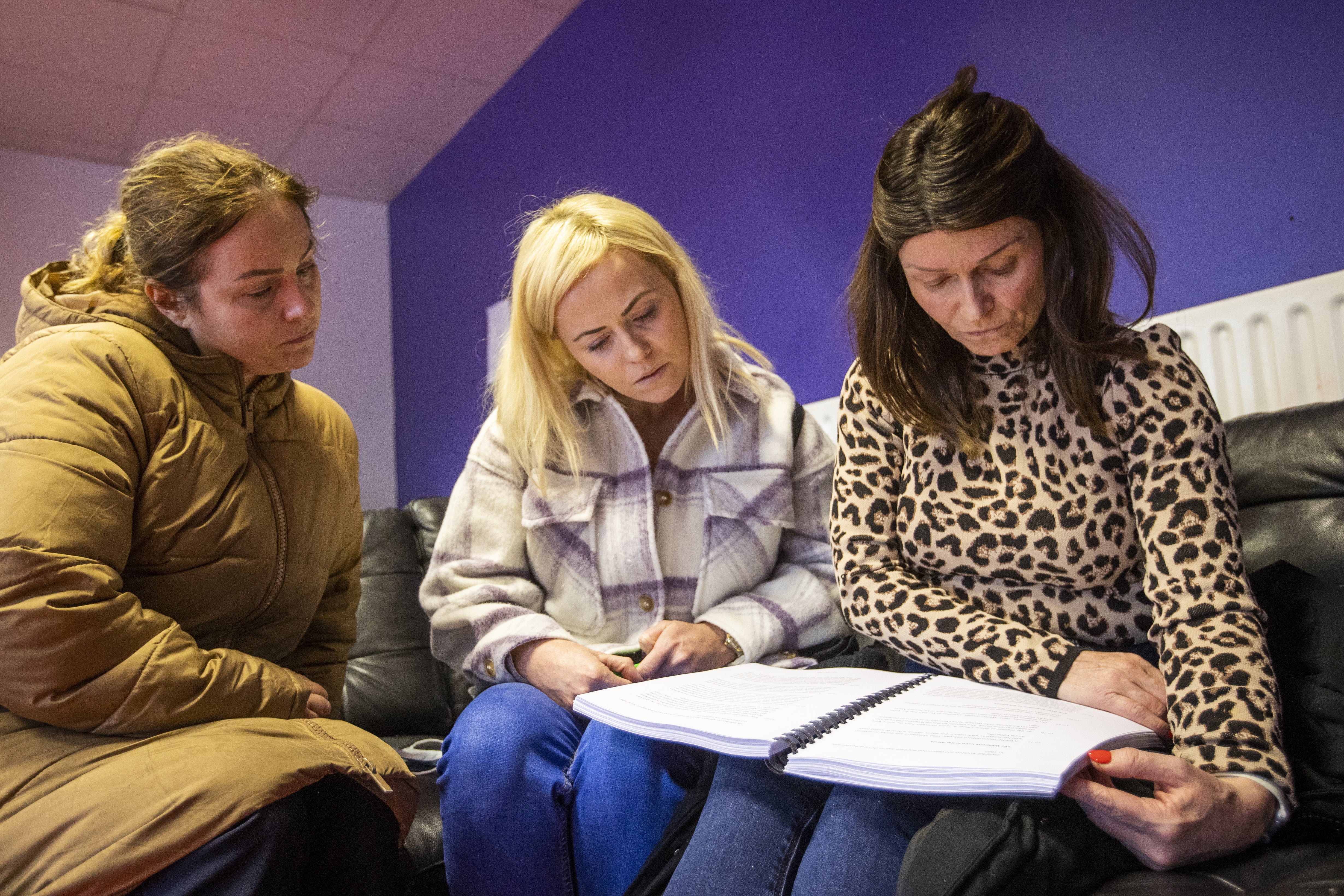 Mairead Gibson, Laura Raffo, and Joanne Maxwell, daughters of Christy Doherty, who was a victim in the attack on Sean Graham’s Bookmaker (Liam McBurney/PA)