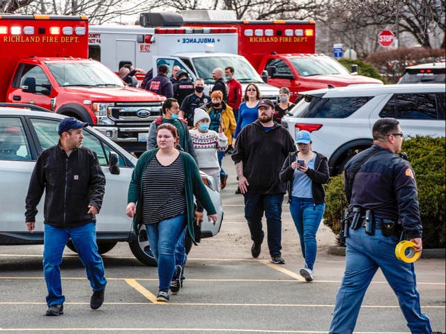 <p>Shoppers and employees are escorted from the Fred Meyer store in Richland, Washington, following a shooting</p>