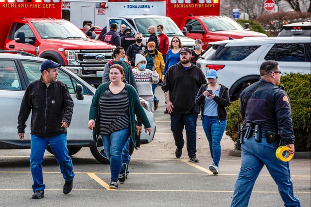 <p>Shoppers and employees are escorted from the Fred Meyer store in Richland, Washington, following a shooting</p>