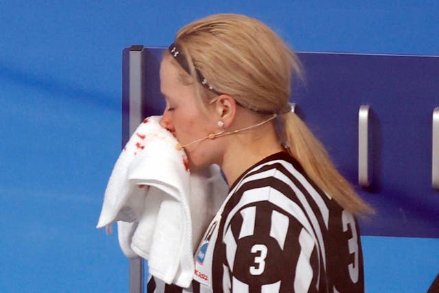 <p>Referee Cianna Lieffers pouring with blood after a stick to the face </p>