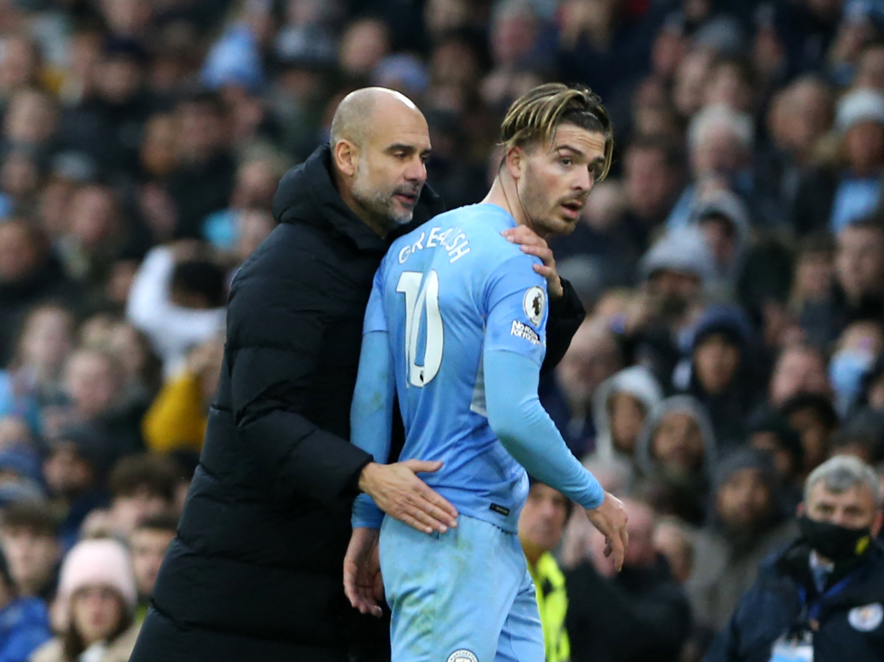 <p>Manchester City manager Pep Guardiola and Jack Grealish</p>
