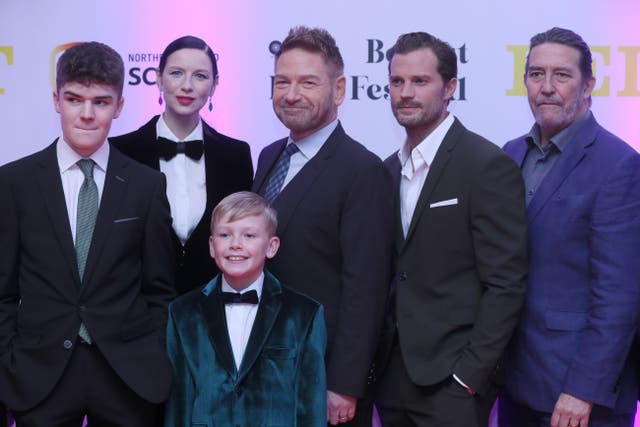 (left to right) Lewis McAskie, Caitriona Balfe, Kenneth Branagh, Jamie Dornan and Ciaran Hinds with Jude Hill in front at the Irish premiere of Belfast (Brian Lawless/PA)